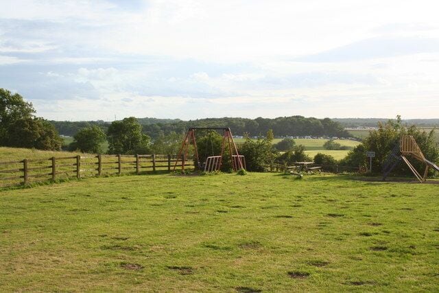 Whittlebury The view from Whittlebury across to Silverstone. The caravans in the fields are accommodating motor racing fans for the British Grand Prix.