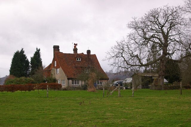 Orchard Farm One of a number of cottages off Lawrence Lane. The building dates from the 16th century with 17th century additions. From 1776 to 1829 it served as the Buckland workhouse. It is grade II listed - for listing particulars see http://www.heritagegateway.org.uk/Gateway/Results_Single.aspx?uid=290164&resourceID=5.