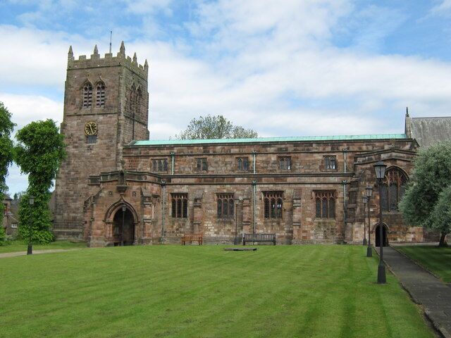 A historic building with a clock tower and arched windows.
