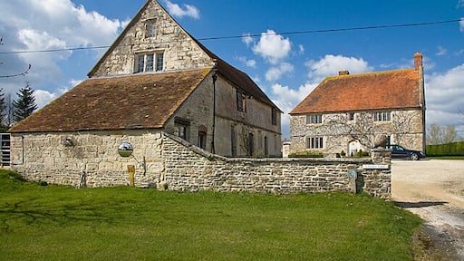 Stable block and farmhouse - Chantry Farm (formerly Pope's Farm), Marnhull Both buildings are of the C17 and Grade II* Listed. The original purpose of the so called stable block is uncertain; the southern end does indeed contain evidence of stabling, but the northern part has pegged wooden beams, probably for use in the manufacture of candles. The building group has been renamed Chantry Farm.