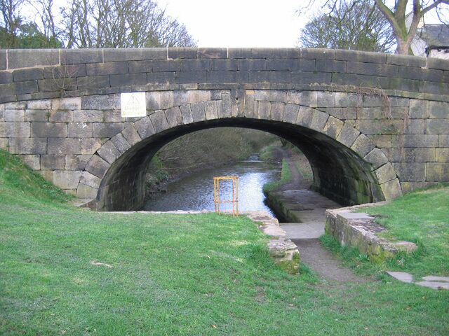 Lancaster Canal, Whittle-le-Woods Looking through the Chorley Old Road canal bridge, towards Whittle Tunnel on the abandoned southern section of the Lancaster Canal. A plaque on the other side of the bridge states that the first loaded barge passed through the tunnel on 1 June 1803.