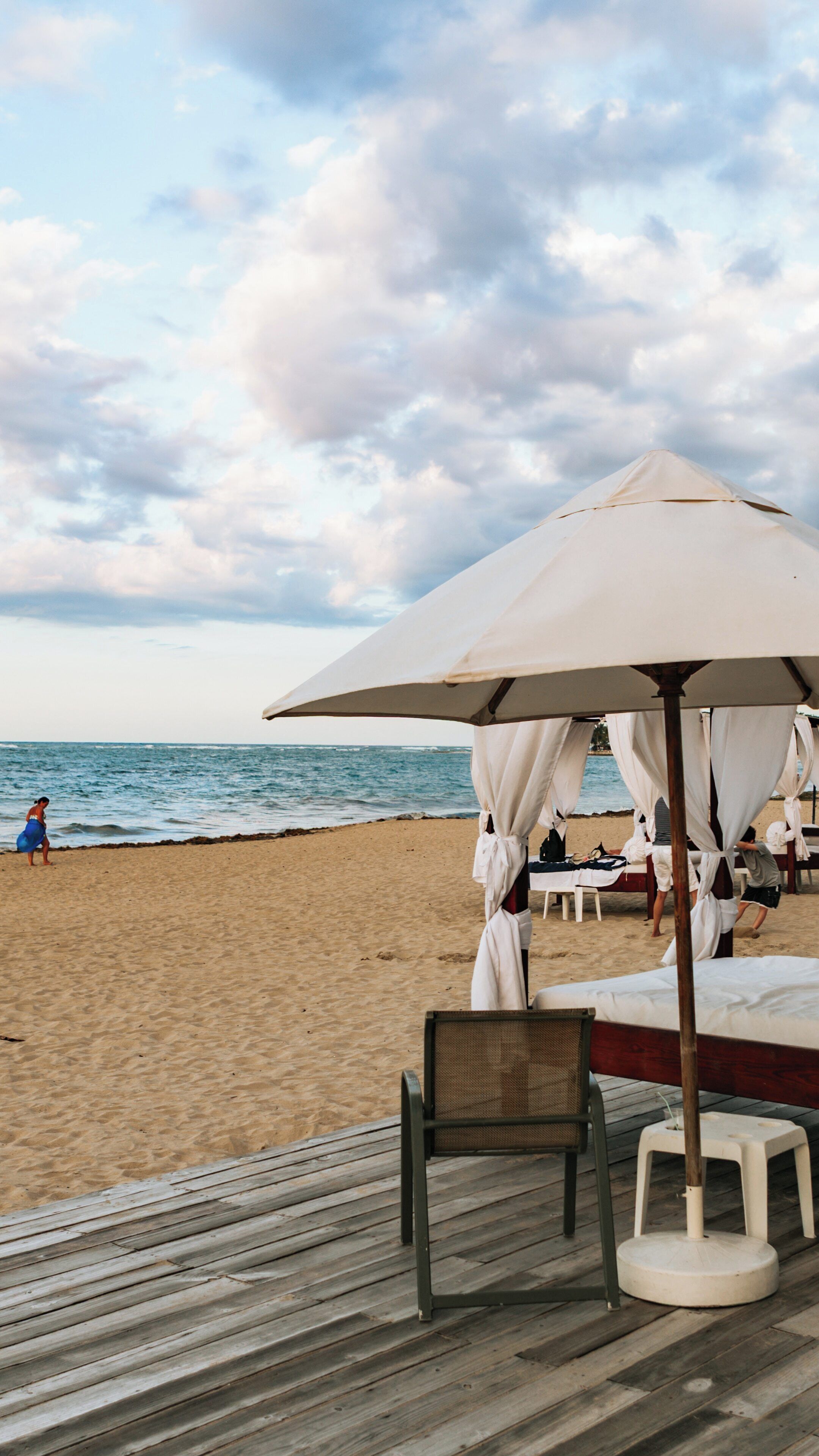 Relaxing beach atmosphere at Playa Dorada, Puerto Plata in the Dominican Republic with people enjoying the sun and sea