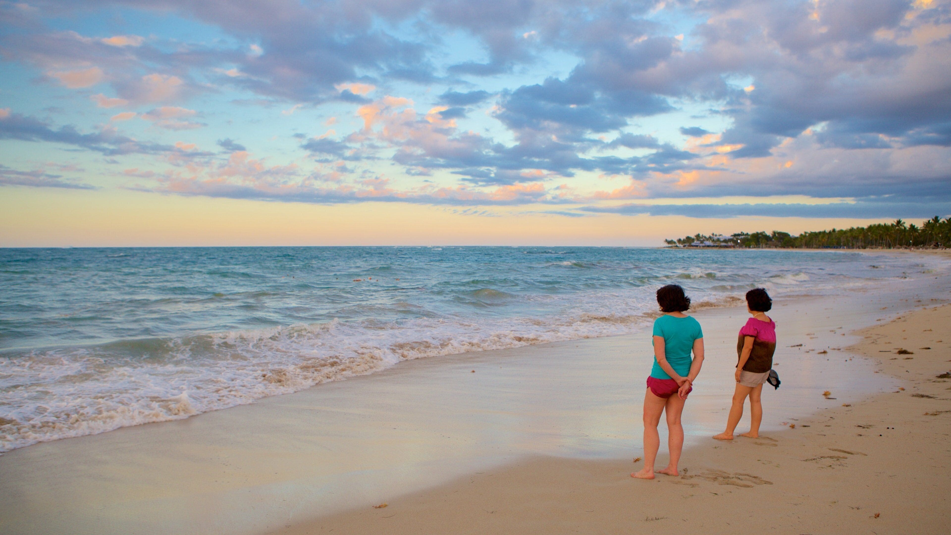 Puerto Plata featuring a beach as well as a small group of people