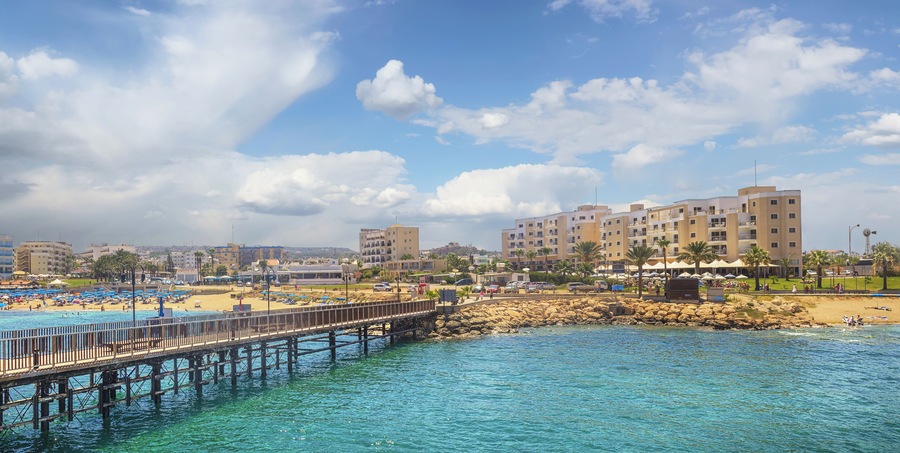 The pier and the beach of Protaras on a sunny day.