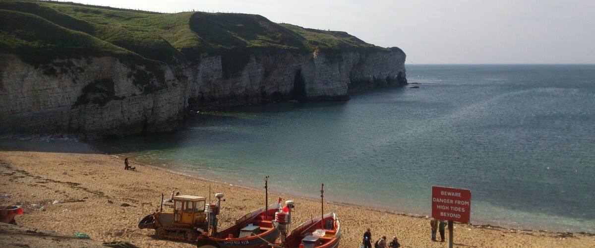This is one of my favourite places in the world, nostalgia of childhood holidays, this little gem is tucked away on the East Yorkshire coast. When the tide is out you can explore the caves - some of which take you right through, just be careful the tide can come in fast! 
You can also take boat trips to Bempton Cliffs to see the puffins. 
Parking is about 50p an hour, there's a pub, cafe and icecream parlour in the old lifeboat station. There's also clifftop walks and spectacular views. 
#Waterlust  
#WeekendGetaway
#YorkshireDay