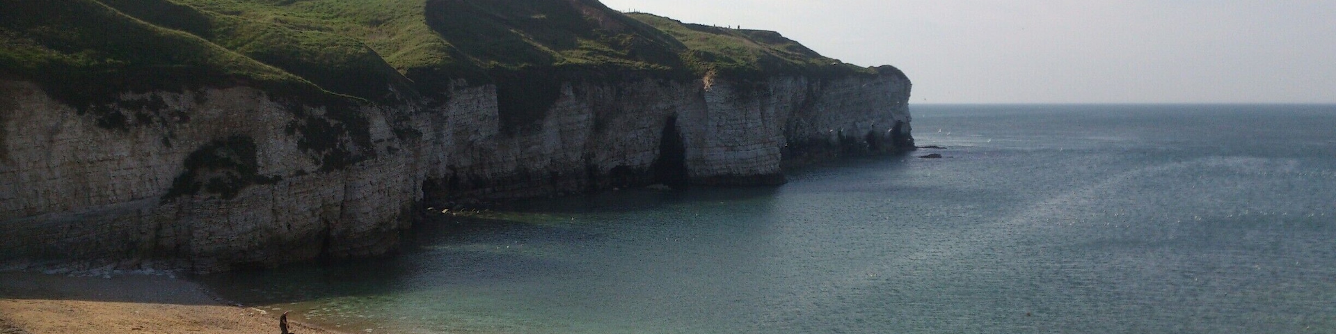 This is one of my favourite places in the world, nostalgia of childhood holidays, this little gem is tucked away on the East Yorkshire coast. When the tide is out you can explore the caves - some of which take you right through, just be careful the tide can come in fast! 
You can also take boat trips to Bempton Cliffs to see the puffins. 
Parking is about 50p an hour, there's a pub, cafe and icecream parlour in the old lifeboat station. There's also clifftop walks and spectacular views. 
#Waterlust  
#WeekendGetaway
#YorkshireDay