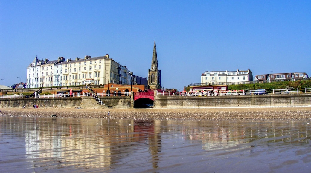 Lovely sandy beach with reflection.