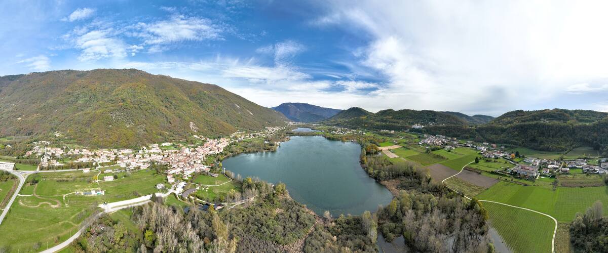 A town by a lake surrounded by hills.