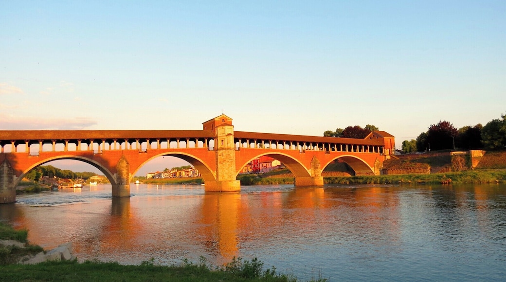 Covered Bridge In Ticino River #GoldenHour #Waterlust #BeachBound