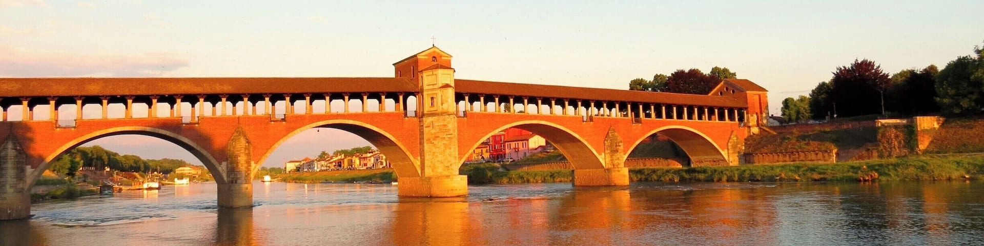 Covered Bridge In Ticino River #GoldenHour #Waterlust #BeachBound