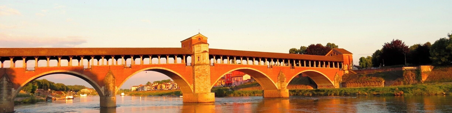 Covered Bridge In Ticino River #GoldenHour #Waterlust #BeachBound