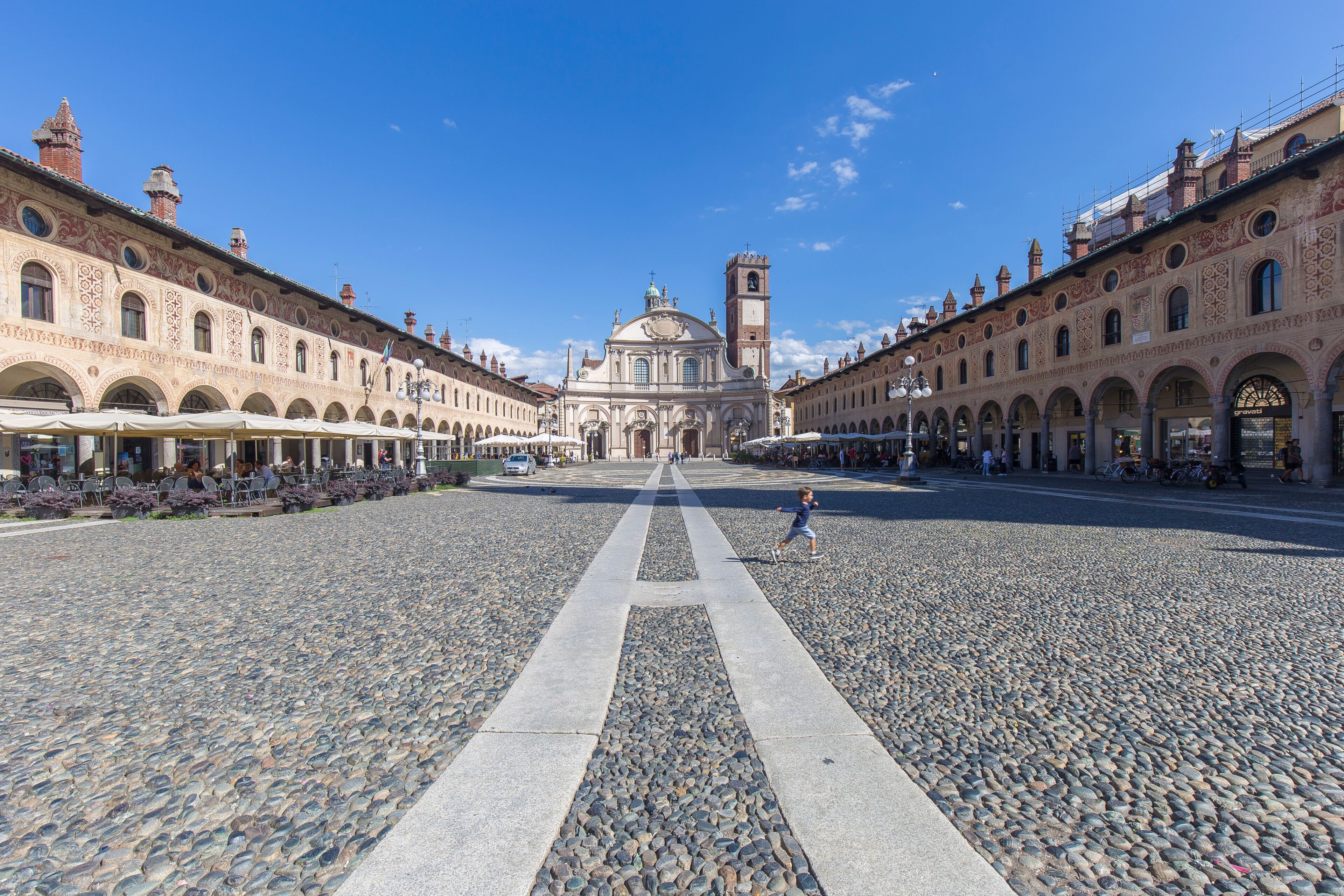 Vigevano, Italy - August 30, 2020: street view of the medieval main square in Vigevano during daylight.