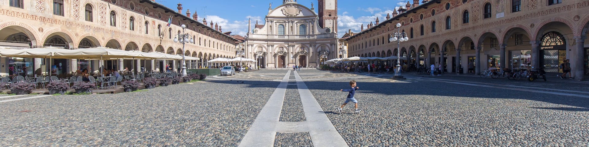 Vigevano, Italy - August 30, 2020: street view of the medieval main square in Vigevano during daylight.