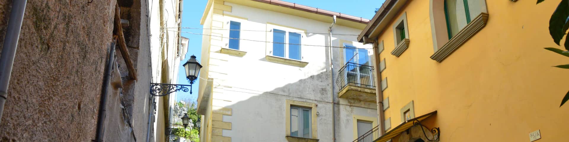 Oliveto Citra, Italy, 04/08/2017. A narrow street between old buildings of a medieval village.