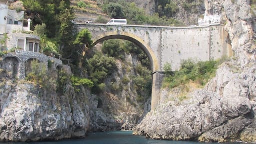 The road along the Amalfi Coast is famous for its hairpin bends, zigzags, the views over the sea, and the narrowness in some parts. The road winds along the cliffs, and it was built at a very steep angle, so zigzags backwards and forwards. The Amalfi Coast drive is arguably the world's most beautiful and thrilling sightseeing road. It stretches 50 kilometers (30 miles) between Sorrento city and Amalfi village, the community that gave the coast its name. It has only occasional railings to keep your car from potentially plunging into craggy, breaker-washed sea boulders far below. You can drive north or south on the drive. The fainthearted (but never the brave) prefer the northbound direction because the southbound lane precariously hugs the sea cliff edge.