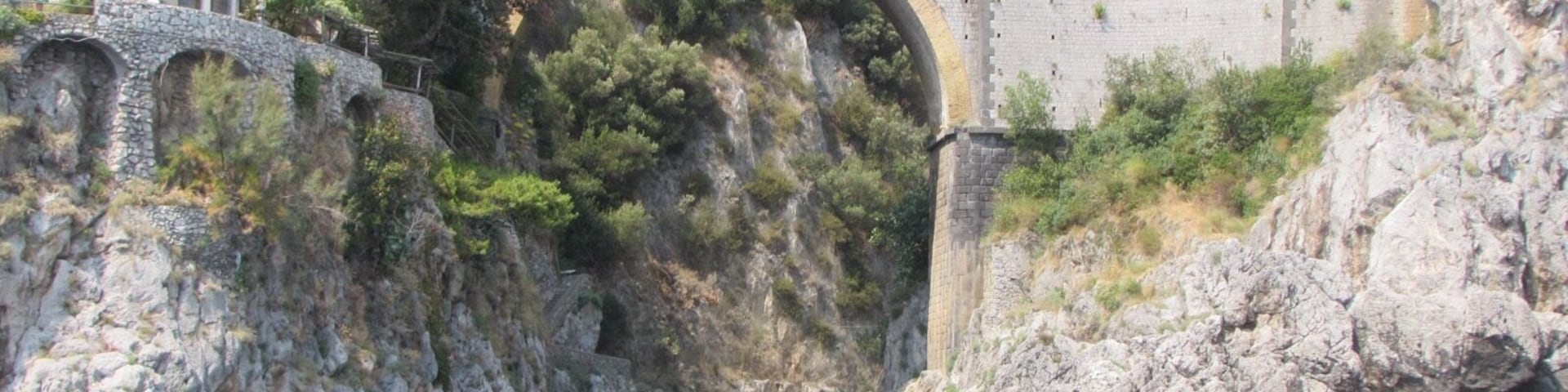 The road along the Amalfi Coast is famous for its hairpin bends, zigzags, the views over the sea, and the narrowness in some parts. The road winds along the cliffs, and it was built at a very steep angle, so zigzags backwards and forwards. The Amalfi Coast drive is arguably the world's most beautiful and thrilling sightseeing road. It stretches 50 kilometers (30 miles) between Sorrento city and Amalfi village, the community that gave the coast its name. It has only occasional railings to keep your car from potentially plunging into craggy, breaker-washed sea boulders far below. You can drive north or south on the drive. The fainthearted (but never the brave) prefer the northbound direction because the southbound lane precariously hugs the sea cliff edge.