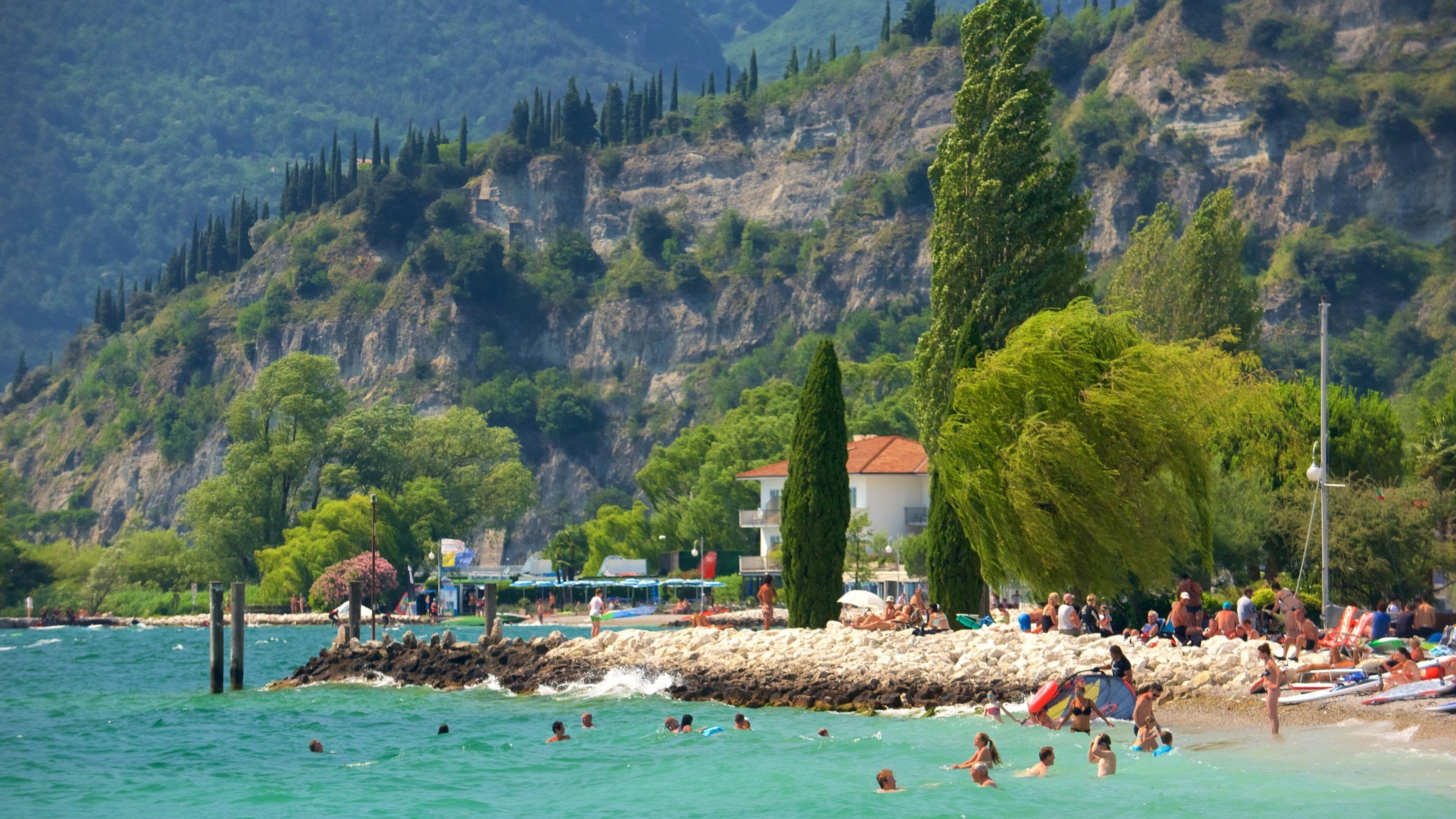 Nago-Torbole featuring rocky coastline and general coastal views