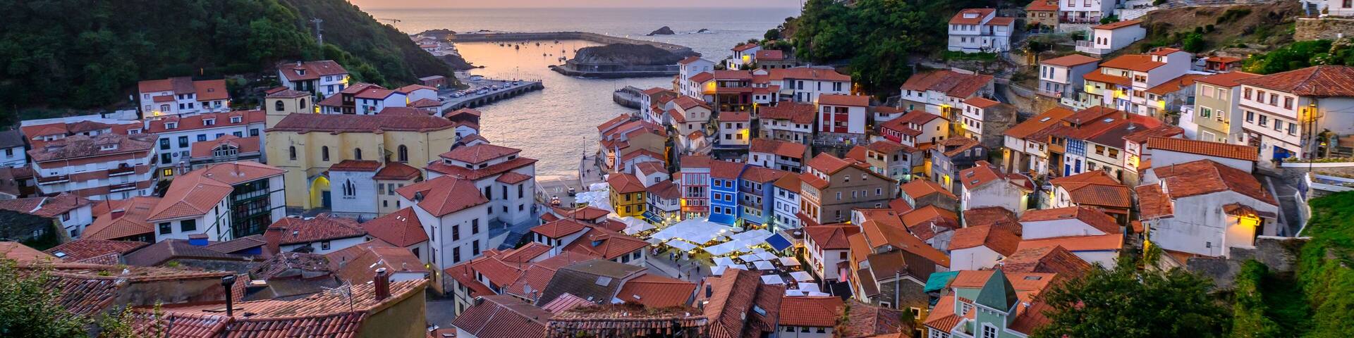 Cudillero fishing village Asturias Spain panoramic aerial sunset view port