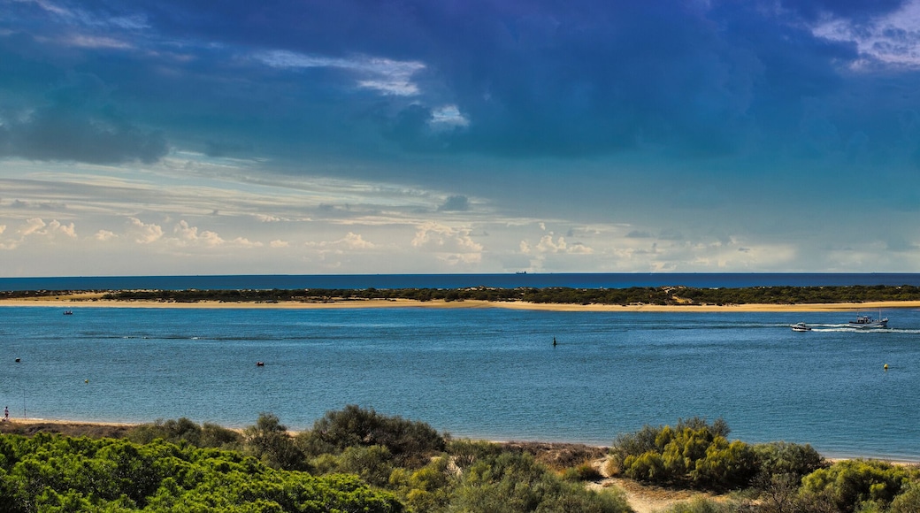 Panoramic of El Portil beach with sky clouds