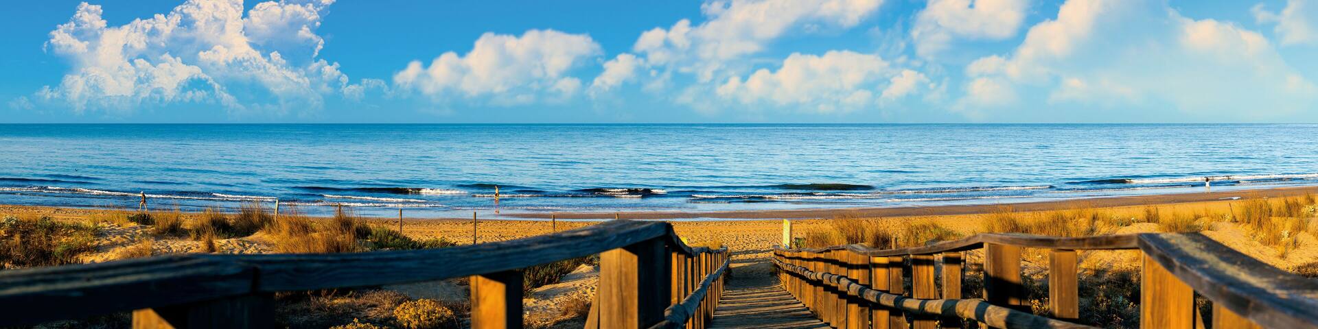 Panoramic of El Portil beach with sky clouds