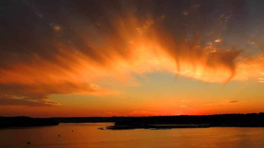 brilliant sunset in osage beach, over the water at lake of the ozarks, missouri