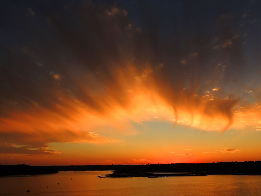 brilliant sunset in osage beach, over the water at lake of the ozarks, missouri