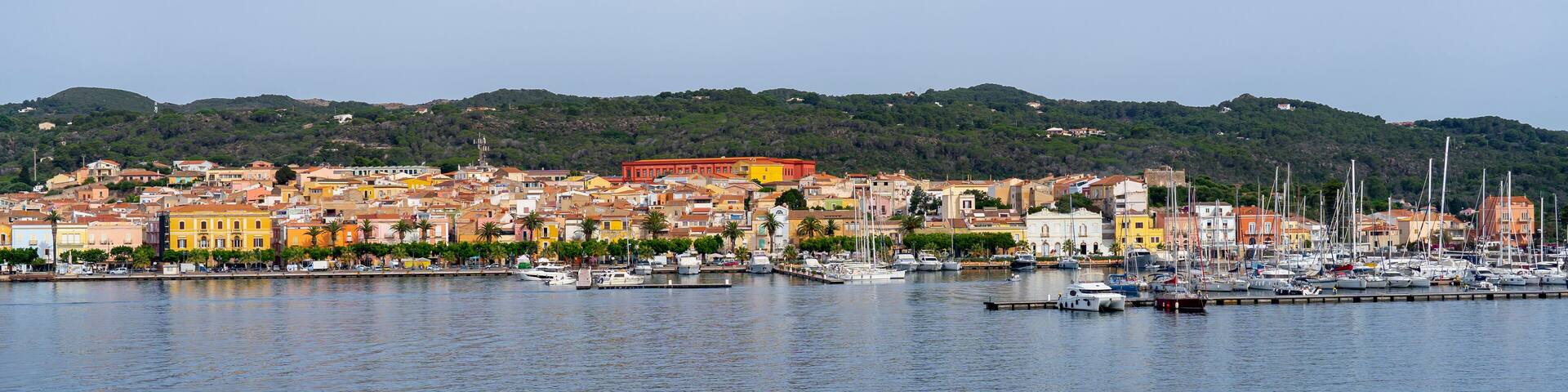 Carloforte. Sardegna. Wonderful cityscape of the town from the boat that is approaching the island. Carloforte is the main city of the San Pietro island