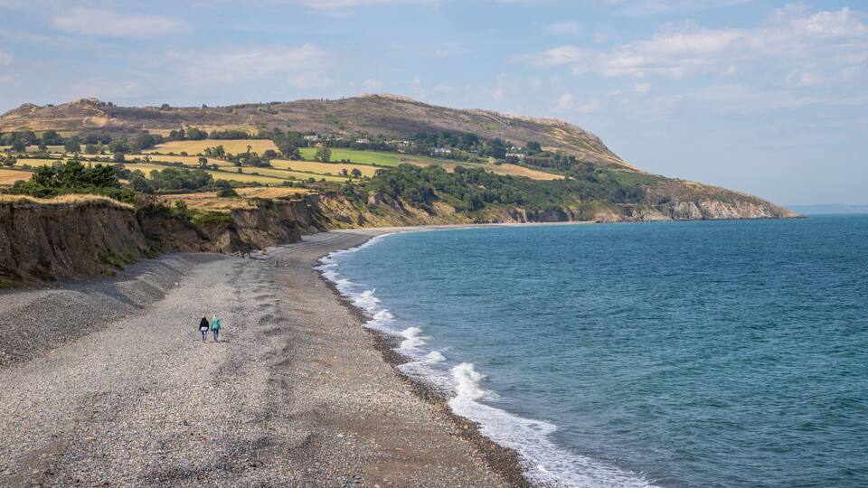 Two women walking in Greystone beach