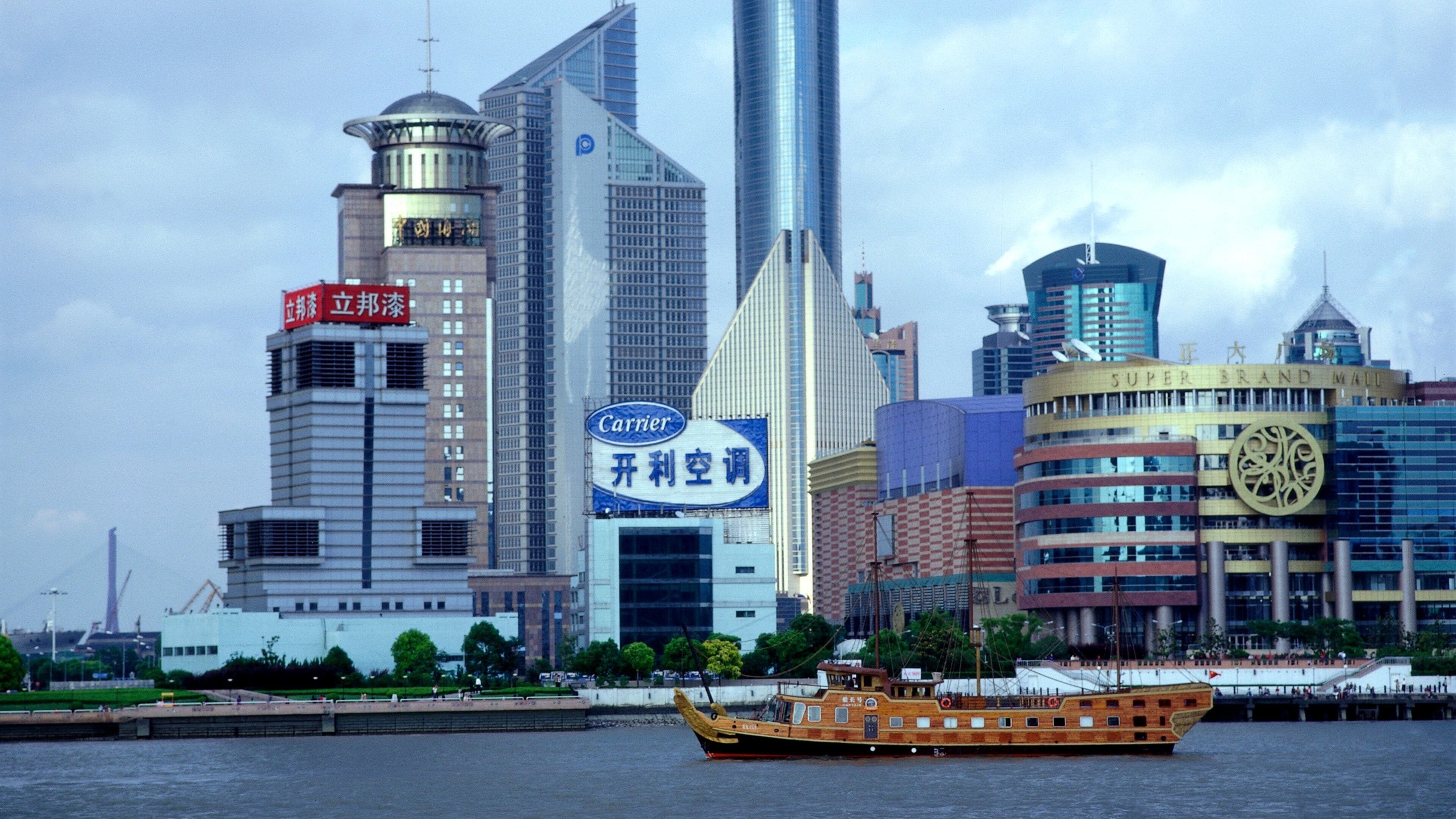 Shanghai which includes modern architecture, a river or creek and a high rise building