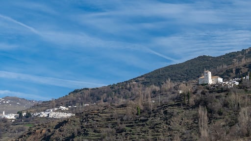Panoramic view of the picturesque Granada village of Capileira (1436 m altitude) and Bubion in the Alpujarra on a sunny winter morning