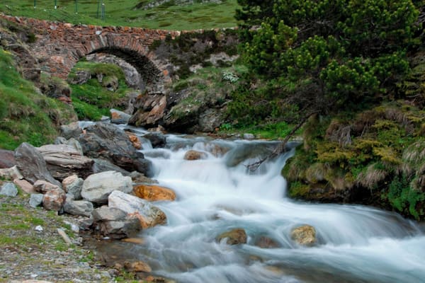 Nature and landscape high up at the mountains in the eastern Pyrenees. The air is fresh with surrounding greenery and stunning rapids. #pyrenees #spain #waterfall #nature #landscape
