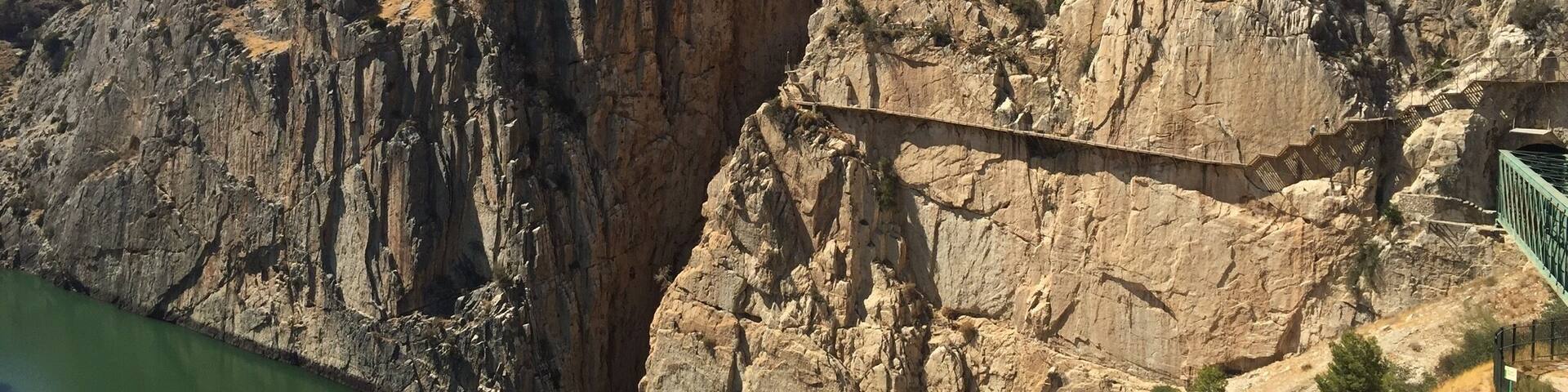 El Caminito del Rey is a very beautiful walkway, pinned along the steep walls of a narrow gorge in El Chorro, Spain. This picture shows part of the path.
If you are visiting Malaga, it is easily accessible with a renfe train which takes about 40 minutes.