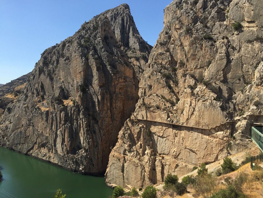 El Caminito del Rey is a very beautiful walkway, pinned along the steep walls of a narrow gorge in El Chorro, Spain. This picture shows part of the path.
If you are visiting Malaga, it is easily accessible with a renfe train which takes about 40 minutes.