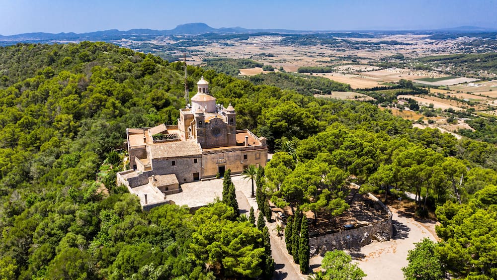 Aerial shot of Santuari de Bonany Monastery on sunny day, Petra, Balearic Islands, Spain