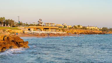 Beautiful beach with white sand located in the tourist region of Paphos, Cyprus. September 2023