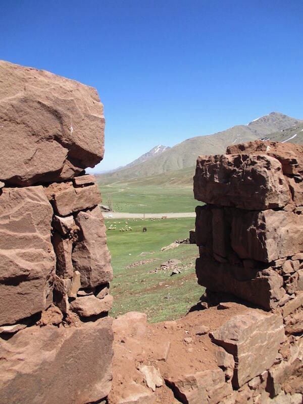 A view from inside one of the 'shepherd shelters' at the base of this ski resort.  You can just barely see a flock of sheep in the distance.

Mt. Toubkal is behind me during this shot (the second highest mountain in Africa).

https://davenotravels.blog