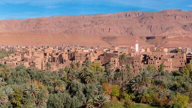 River area at M’Goun Valley – the Valley of the roses, where blossoms are harvested to make Rose Oil and other cosmetic products. Todra gorge and high atlas mountain. Berber houses