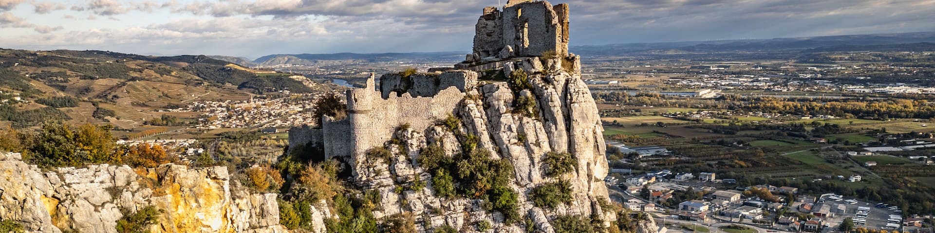 Ruins of Château de Crussol, a 12th Century Medieval Castle on a Hilltop Overlooking the Rhône Valley in Saint-Péray, Ardèche, Opposite Valence, France – Aerial Scenic View