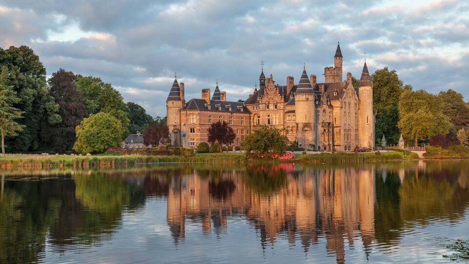 A castle with multiple towers and a moat.