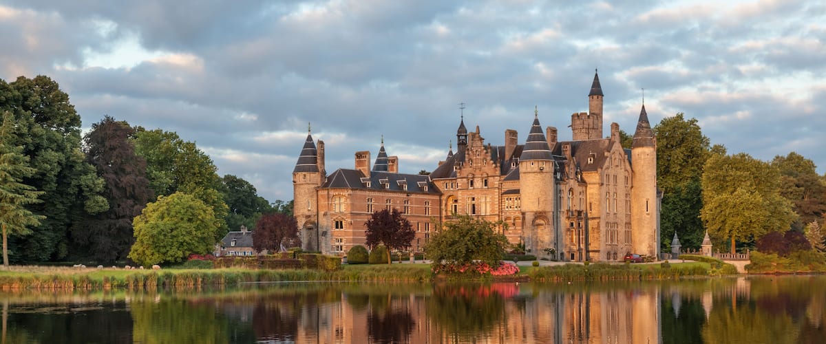 A castle with multiple towers and a moat.