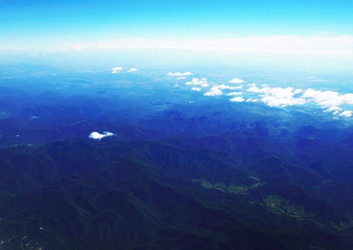 Foja mountain range from the flight window. According to the computer screen it was nearly 1100m ahead of Indonesia. Nice view of mountain ranges, forests and rivers. Really, It's breath-taking.