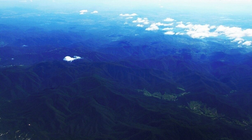 Foja mountain range from the flight window. According to the computer screen it was nearly 1100m ahead of Indonesia. Nice view of mountain ranges, forests and rivers. Really, It's breath-taking.