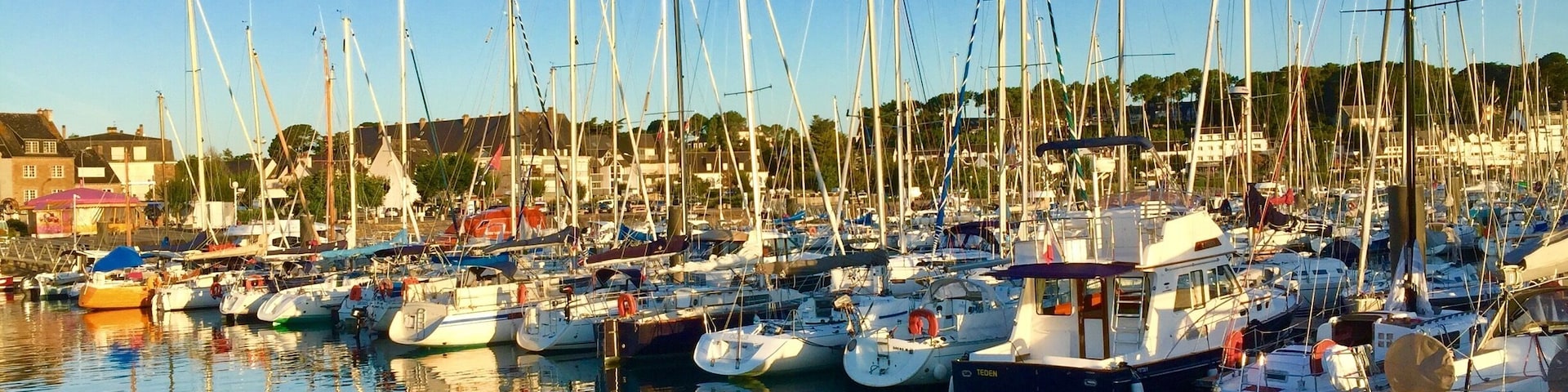 The smart harbour with its ranks of yachts.
