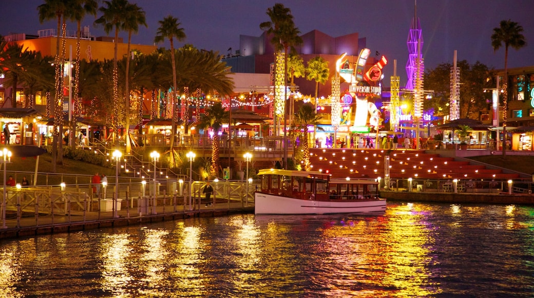 Vibrant night view of Universal Studios Florida showcasing lights and attractions by the water