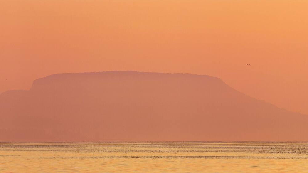 #golden
The Badacsony is a mountain top on the north shore of Lake Balaton. The settlement lying next to the mountain and region also shares the name Badacsony. The entire area is recognized for its wine, with vineyards dating back to Roman times. This basalt mountain is a unique geological relic.