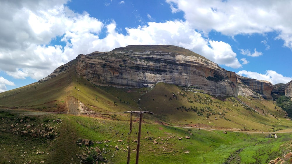 Fluffy clouds over rock formations in the Golden Gate Highlands National Park, Clarens, Free State, South Africa