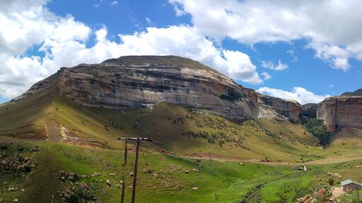 Fluffy clouds over rock formations in the Golden Gate Highlands National Park, Clarens, Free State, South Africa