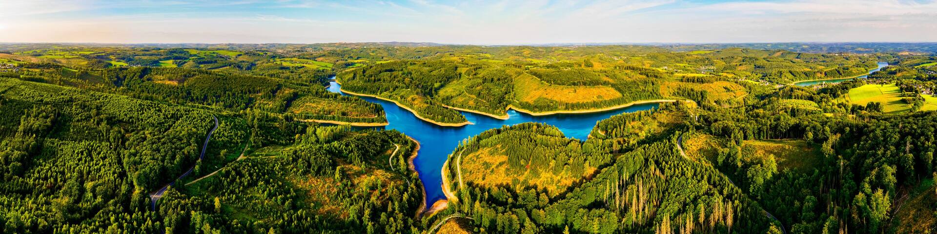 the bergisches land landscape with a dam in germany from above panorama