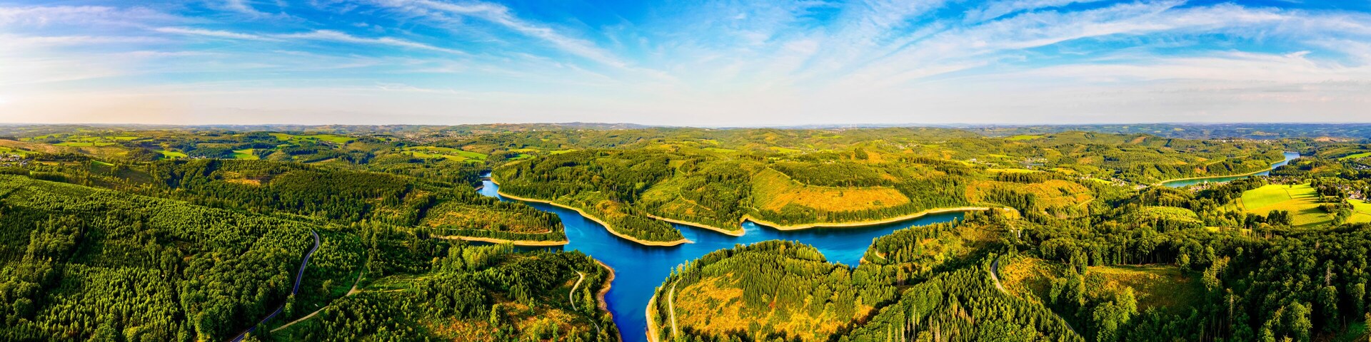 the bergisches land landscape with a dam in germany from above panorama