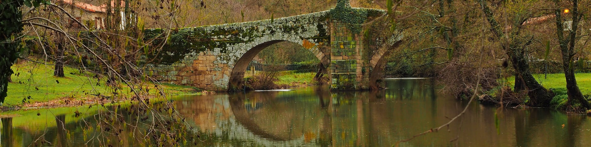Roman bridge reflected in the river